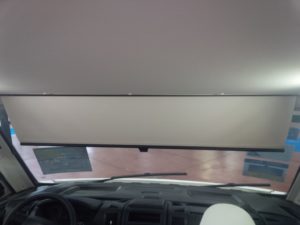 manual scissor sunshade on a rvi windshield